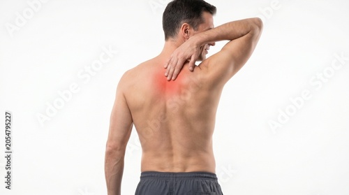 Man experiencing back pain holding shoulder in medical concept with red highlighted area