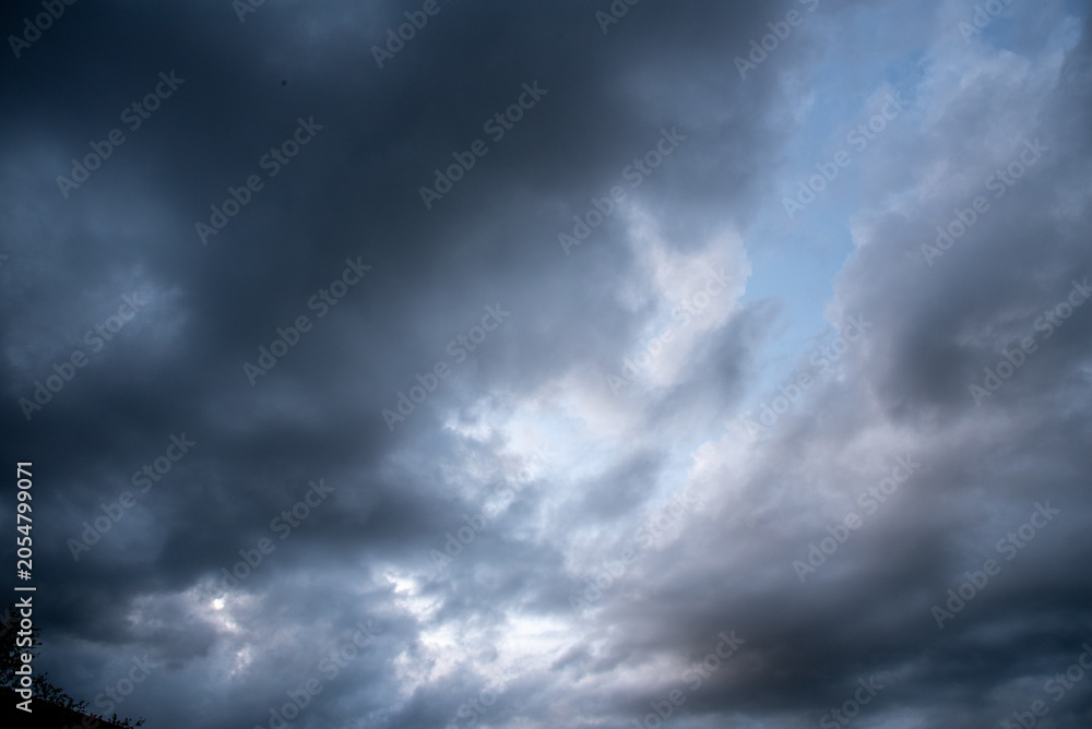 Fototapeta premium Dark cloudscape storm disaster gloomy gray cloud sky. Dramatic dark storm rain clouds black sky background. Meteorology danger windstorm disasters climate. Dark thunderstorm clouds rainny atmosphere