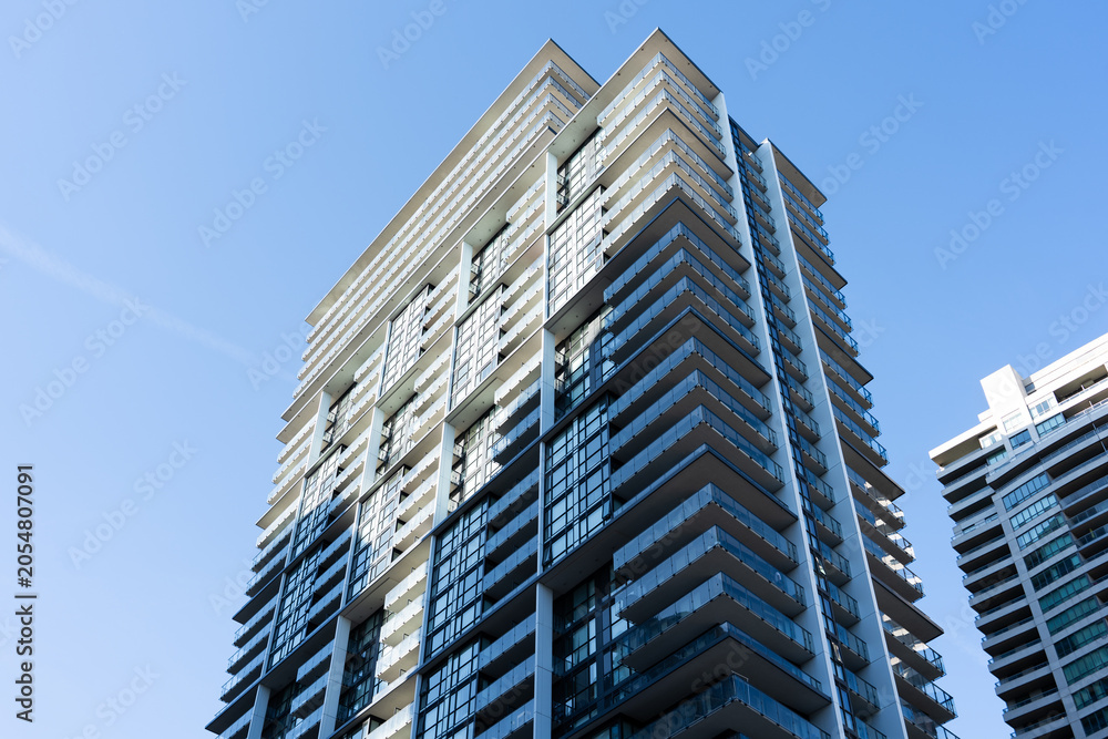 Fototapeta premium Modern high rise residential buildings with glass balconies