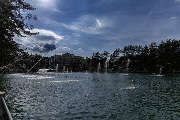 Serbia Zlatibor 24.05.2026 Urban Lakeside Fountains Under Dramatic Cloudy Sky