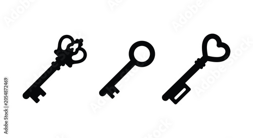 Foto Three antique keys in black silhouette against a white background a decorative c