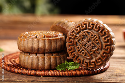 Принти на полотні Handmade Mooncakes with Decorative Patterns on Rustic Wood Table