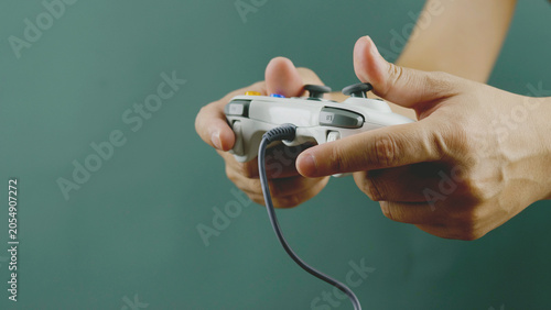 Playing games with a joystick, relaxing, happy, and fun at home. Planning and enjoyment.