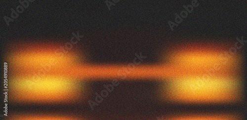 Cuadro en lienzo Symmetrical warm orange and yellow lights against a dark grainy backdrop creatin