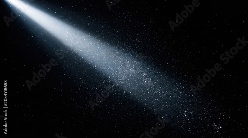 Bright Spotlight Beam Piercing Dark Space with Floating Particles
