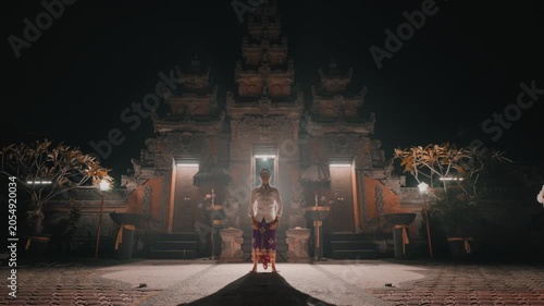 Majestic Night Portrait of Man in Balinese Temple