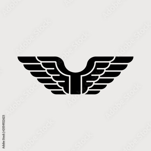 A black silhouette of stylized bird wings on white background