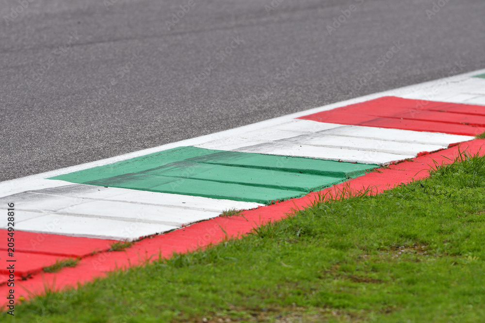 Obraz premium colored curb on a racing track