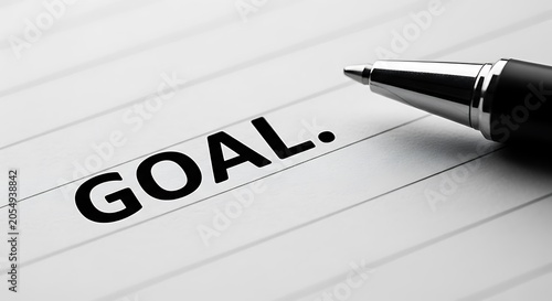 Goal Setting and Achievement with Pen on Lined Paper.