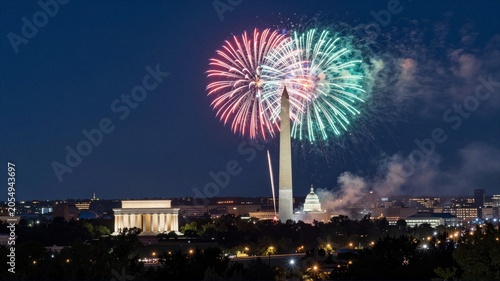 Fireworks over Washington monuments at night