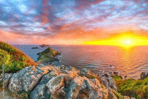 Schilderij op canvas Fantastic sunset over Torra di a Parata with Genoese Tower and Archipelago of Sanguinaires islands at background