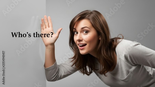 Curious woman eavesdropping on a conversation behind a wall with eagerness expression
