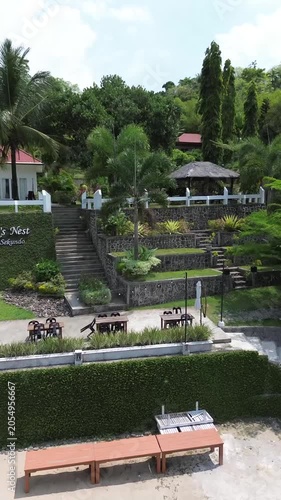 Aerial drone view of a luxury resort at Weh island, Sabang Indonesia. featuring overwater bungalows and turquoise waters. Tropical island in Aceh, Sumatera.