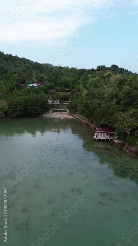 Aerial drone view of a luxury resort at Weh island, Sabang Indonesia. featuring overwater bungalows and turquoise waters. Tropical island in Aceh, Sumatera.