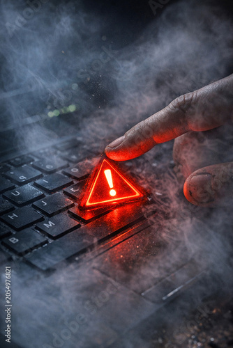 A close-up of a hand pressing the 'escape' key on a computer keyboard with red accents, emphasizing its importance in digital interaction.