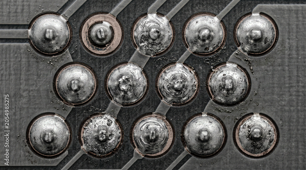 Fototapeta premium PCB solder joints top view dome crater copper pad pewter, mono circuit macro
