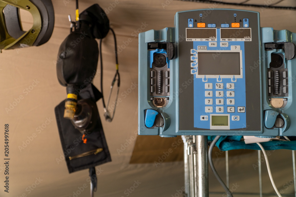 Obraz premium Infusion Pump on field hospital ready for war zone healthcare support
