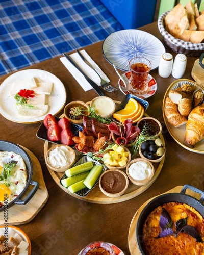 Abundant Turkish breakfast spread with eggs, cheese, olives, and fresh bread