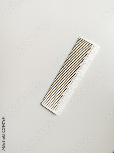 Eco-Friendly White Biodegradable Comb on Minimalist Background