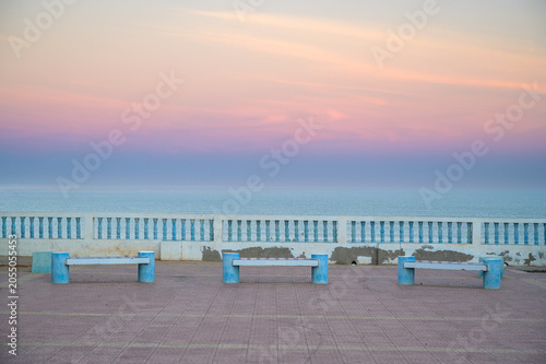 Empty Benches on the Atlantic Promenade at Sunset - Sidi Ifni, Morocco