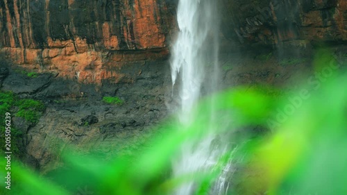 4K Closeup slow motion shot of waterfall hitting the ground during the monsoon season as seen from the forest at Kaataldhar waterfall near Lonavala in Maharashtra, India. Waterfall in monsoon season.