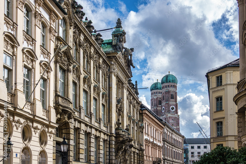 Fototapeta premium Famous Munich Cathedral, also called Cathedral of Our Dear Lady in Munich, Germany. Seen from Kardinal-Faulhaber street