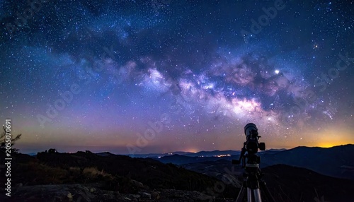 Telescope gazes at the majestic Milky Way galaxy stretching across the starry night sky.