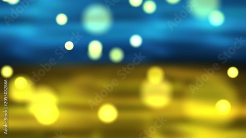 Abstract summer background with golden bokeh lights and blue sky tones, creating a warm sunny atmosphere perfect for seasonal designs.