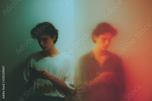 Diptych portrait of a teen looking at a phone with anxious and distracted expressions for mental health awareness poster