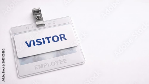 Visitor identification badge on white background for office access