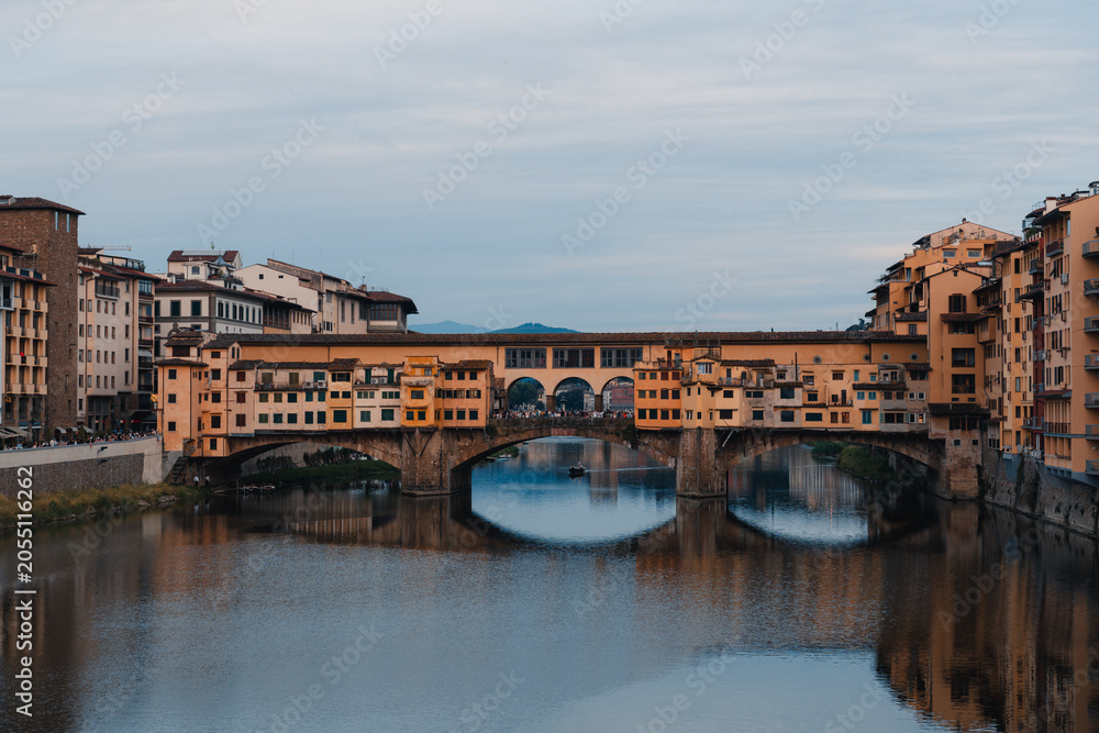 Fototapeta premium Ponte Vecchio bridge reflection in Florence blue hour