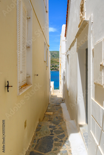 Narrow street of the town of Chora. Andros Island, Cyclades, Greece