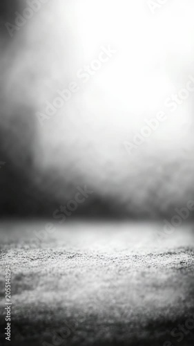 Abstract black and white background with dramatic lighting and textured surface, creating a moody and atmospheric scene. Perfect for creative projects and modern design concepts