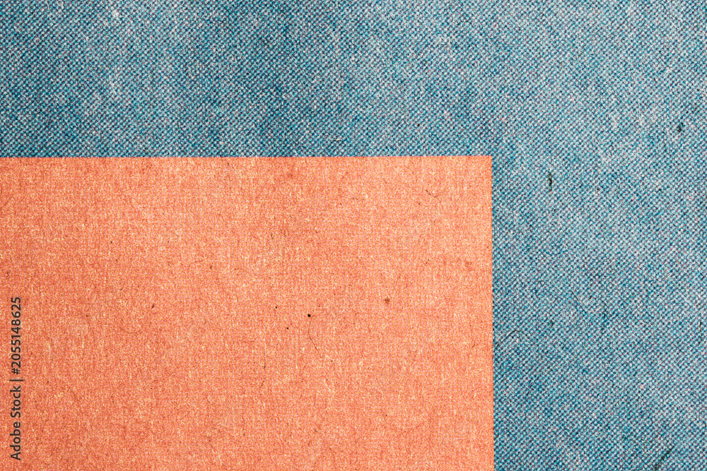 Fototapeta premium Macro Newspaper Print Paper With Orange and Blue Blocks