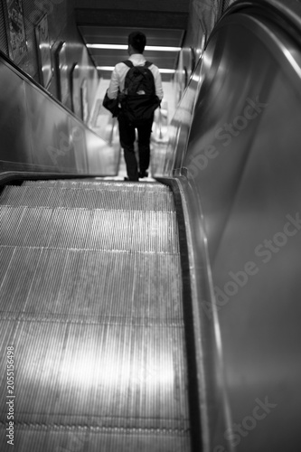 man on escalator