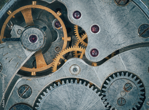 Macro view of old mechanical gears with visible screws and scratches