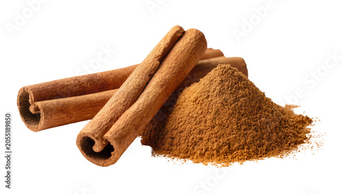 фотографія Isolated cinnamon sticks and a fragrant pile of ground cinnamon powder ready for