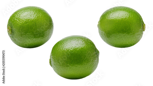 Fotografie Isolated three whole fresh green limes vibrant and ripe citrus fruits close up s