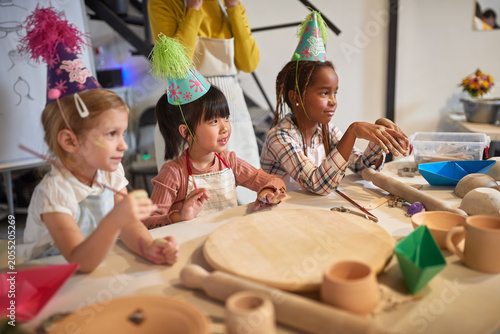Happy kids are creative on a birthday party workshop.  Creative  hobby  workshop  concept