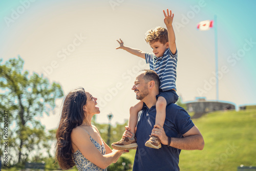 Mother father and son having great time outdoors in a park