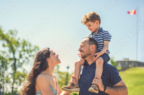 Mother father and son having great time outdoors in a park