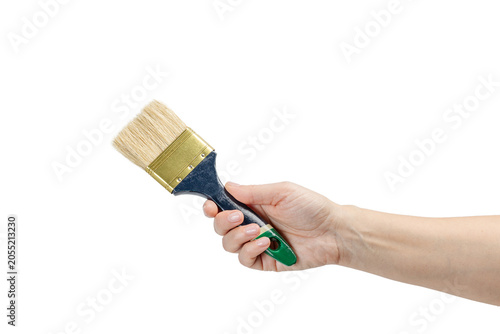 Woman holding a painter brush on a white isolated background. Repair tool.