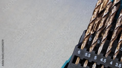 A set of drills for drilling metal in a plastic case.