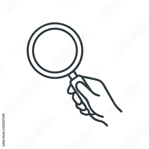 Foto Hand holding a magnifying glass closeup.