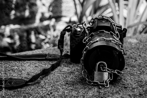 Professional Camera Locked with Chains, Concept of Censorship, Control, and Creative Restriction