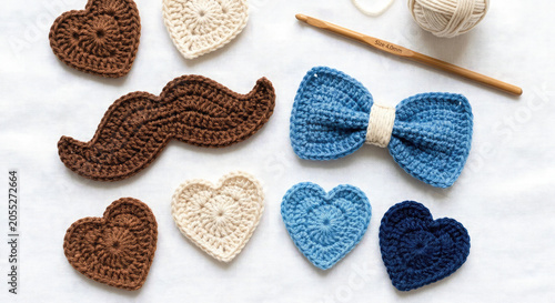 Crochet applique photo for craft poster with handmade hearts bow mustache and yarn hook
