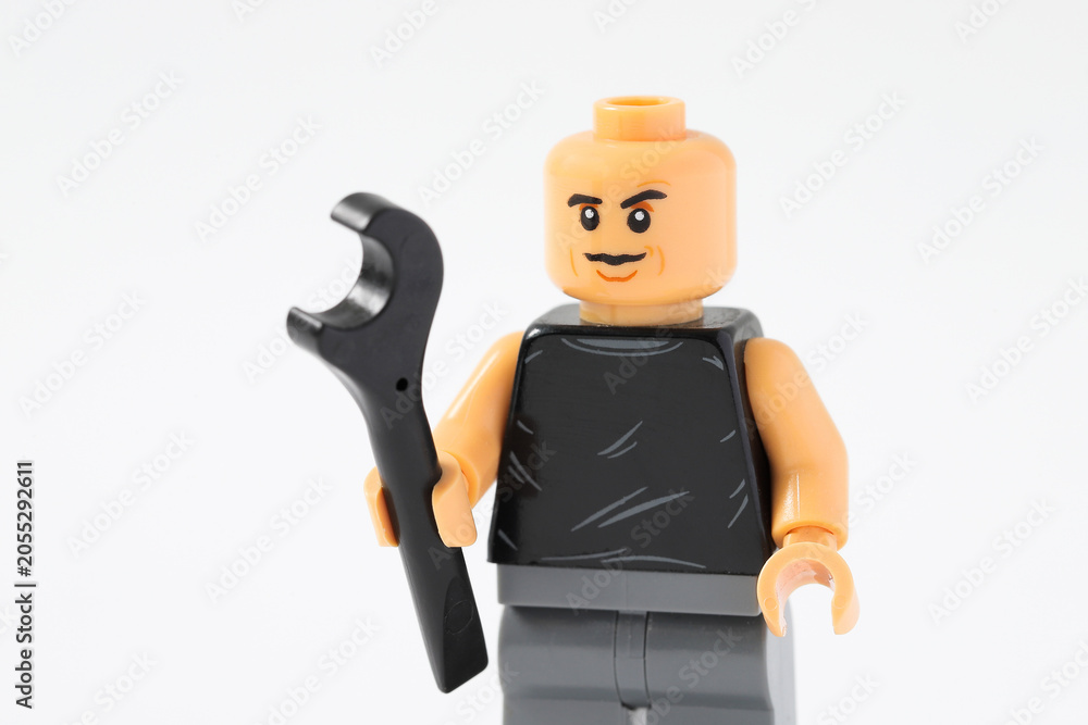 Naklejka premium Lego minifigure of car mechanic with wrench tool