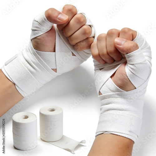 Hand stacking white cups with coins and documents