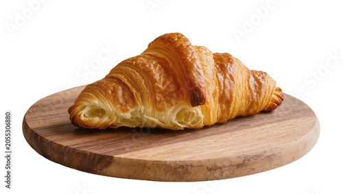 Schilderij op canvas Isolated fresh flaky golden croissant on a rustic wooden serving board, delicious breakfast pastry