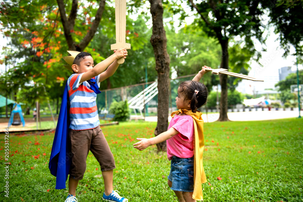 Obraz premium Children playing with wooden swords